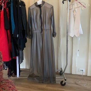 This came from an Estate sale in Hollywood.  It is full length rubber raincoat.